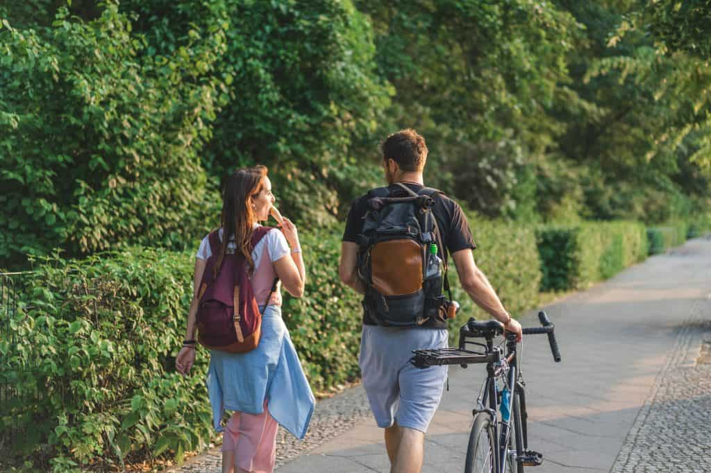 Couple Walking With A Bike