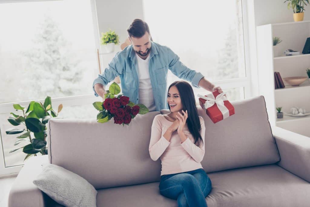 Man Giving Gifts To His Wife