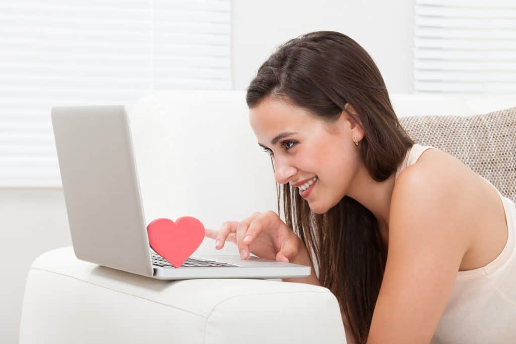 Woman Looking At Her Laptop