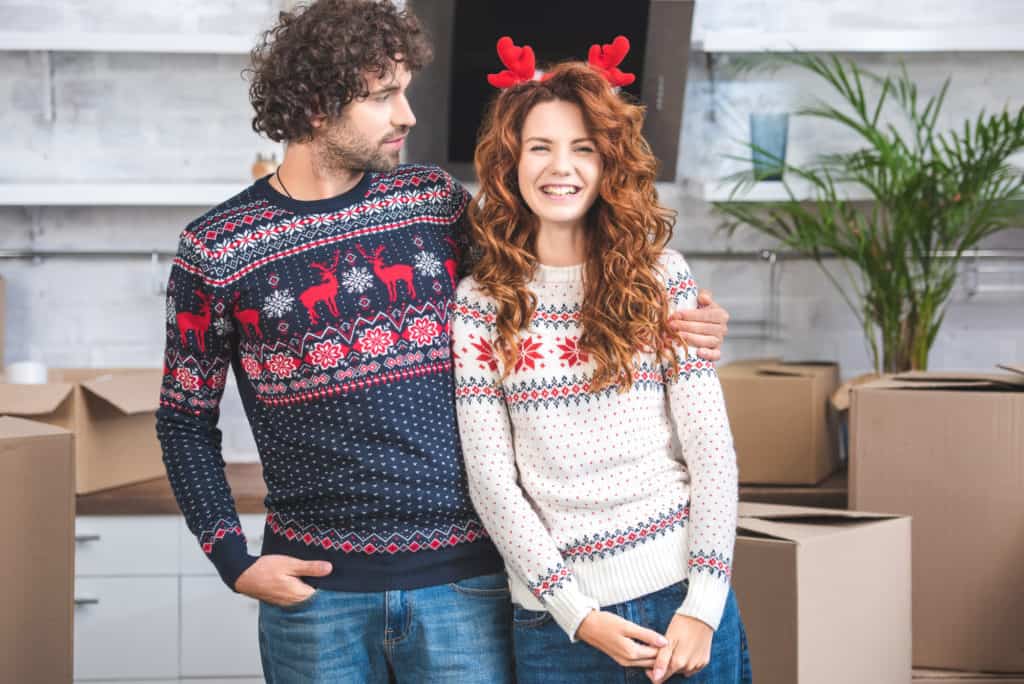 Couple Wearing Christmas Sweaters