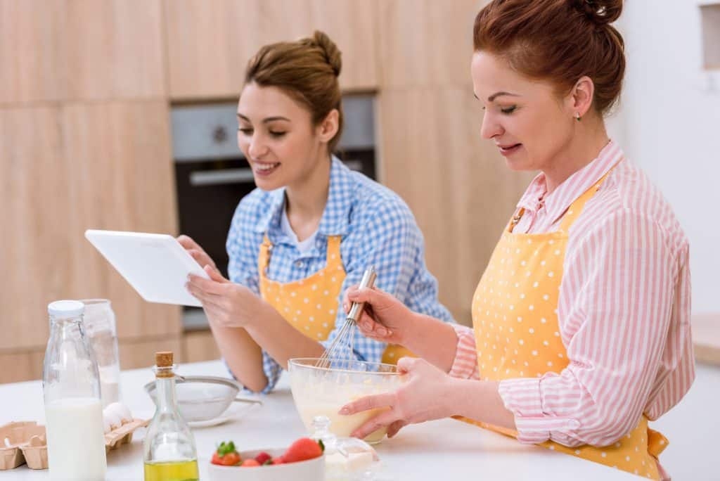 Two Women In The Kitchen Cooking