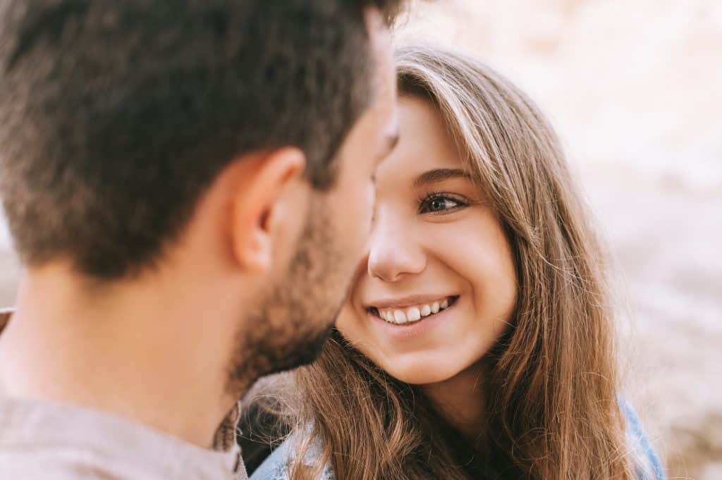 Woman Looking And Smiling At Her Boyfriend