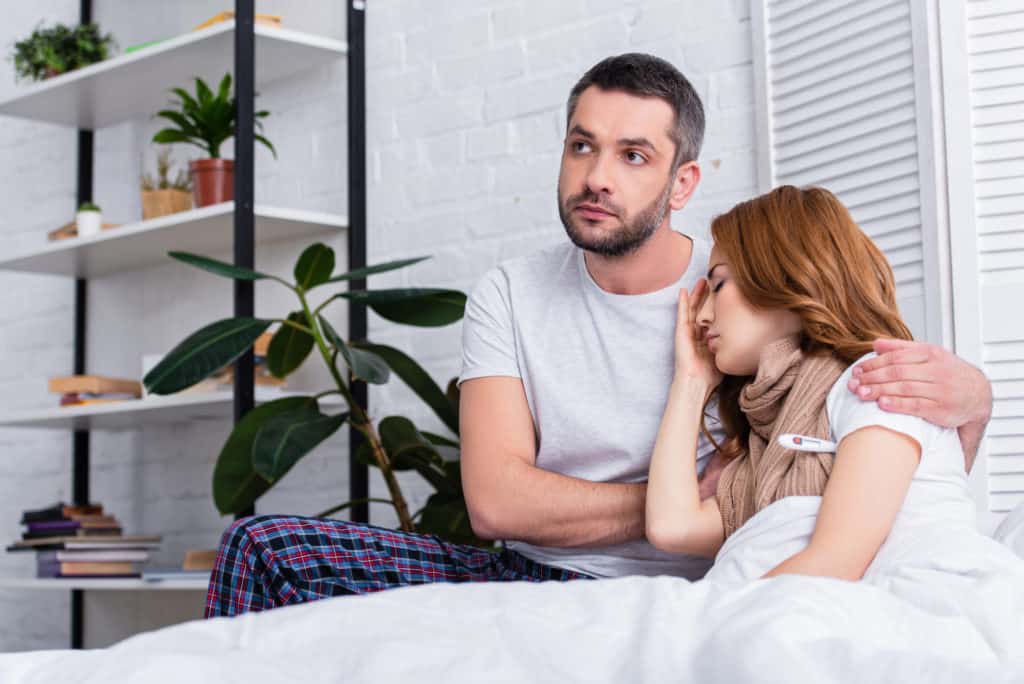 Couple In Bed Wife Not Feeling Well